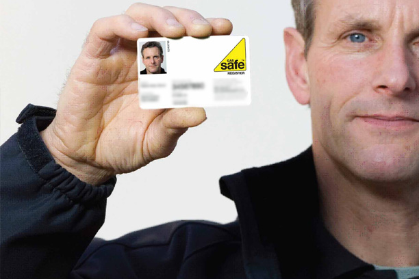 gas engineer holding a gas safe card